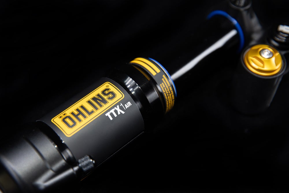 Trunnion version of the TTX1 Air m.2 rear shock on a black background